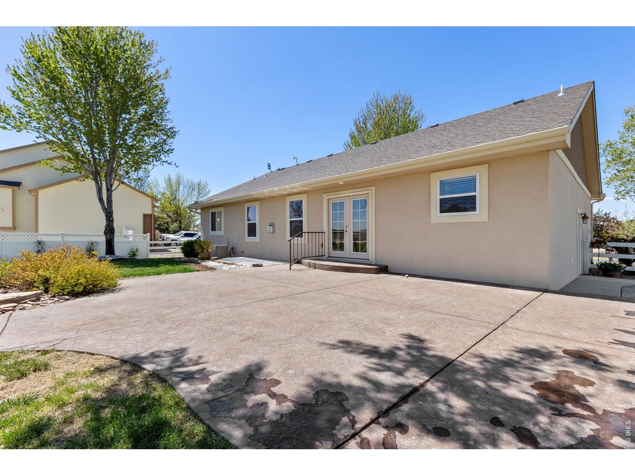The backyard is built for enjoying Colorado living with mature trees, a spacious 550 sq ft stamped patio, and a dedicated firepit area perfect for entertaining on summer evenings. Mature landscaping & trees. Sprinkler system in place. 