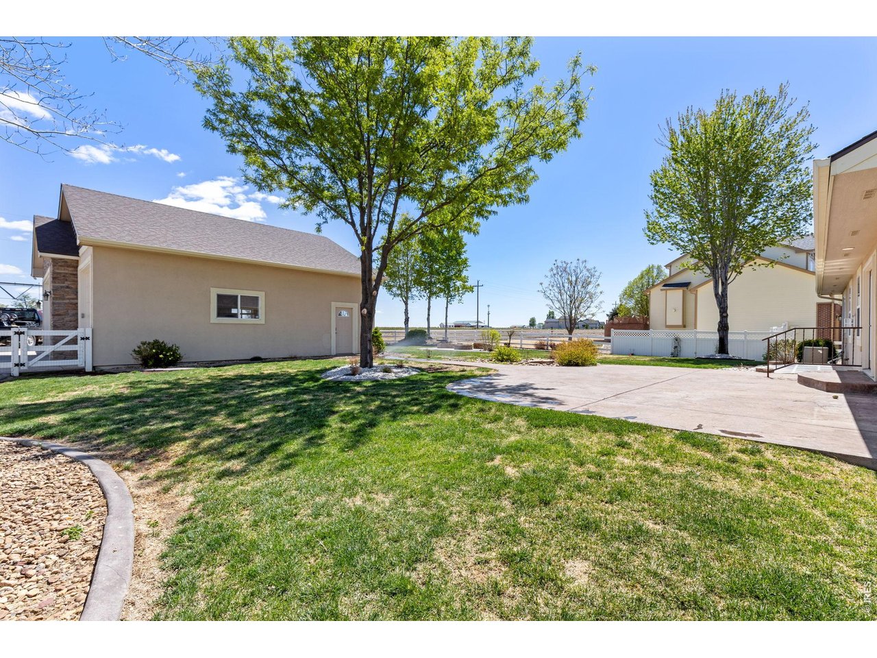 The backyard is built for enjoying Colorado living with mature trees, a spacious 550 sq ft stamped patio, and a dedicated firepit area perfect for entertaining on summer evenings. Mature trees & landscaping! Sprinkler system in place.