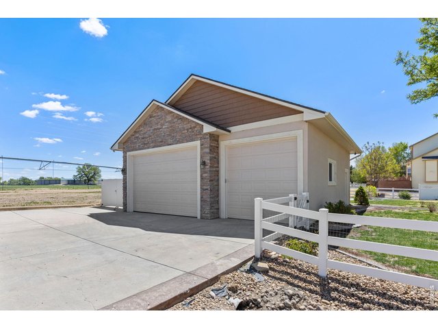 Property Photo 37 One of the standout features is the fully finished and heated 1,080 sq ft shop (34 ft X 32 ft), perfect for projects, storage, or a true hobby space. Shop has 220 AMP service. 