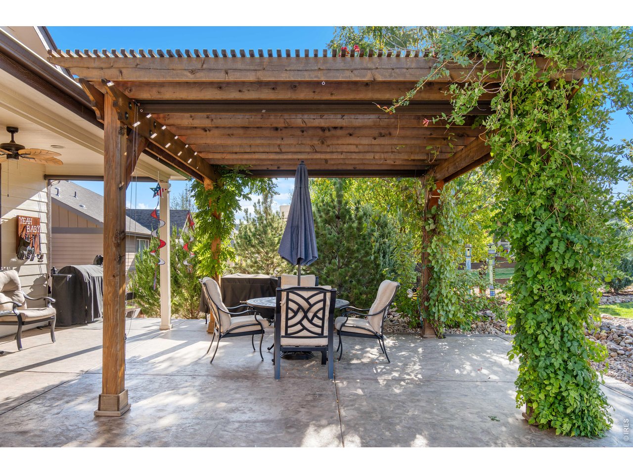 Pergola with 3 Roll Down Shades plus outdoor Ceiling Fan keeps you cool on hot summer days