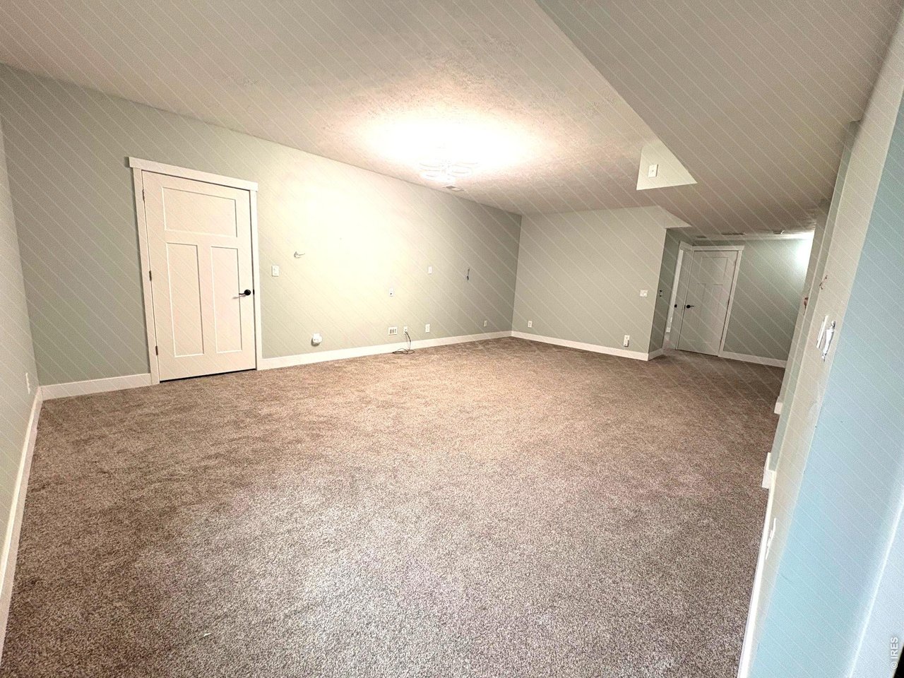 Property Photo 14 Nice open basement with wired surround surround and even more closet storage area.