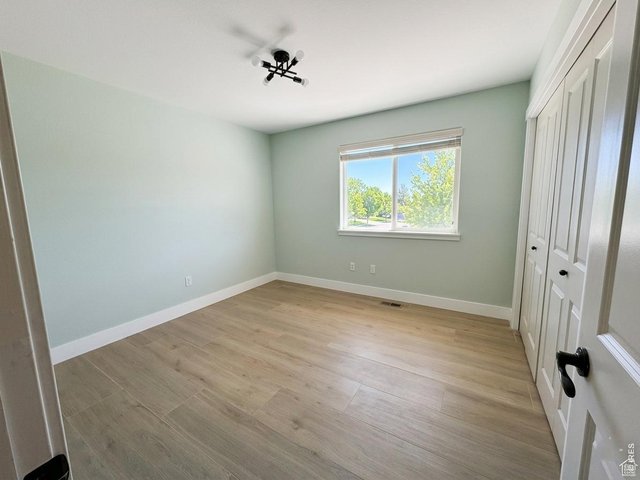 Property Photo 9 Bedroom 2, on the main level with great natural light.