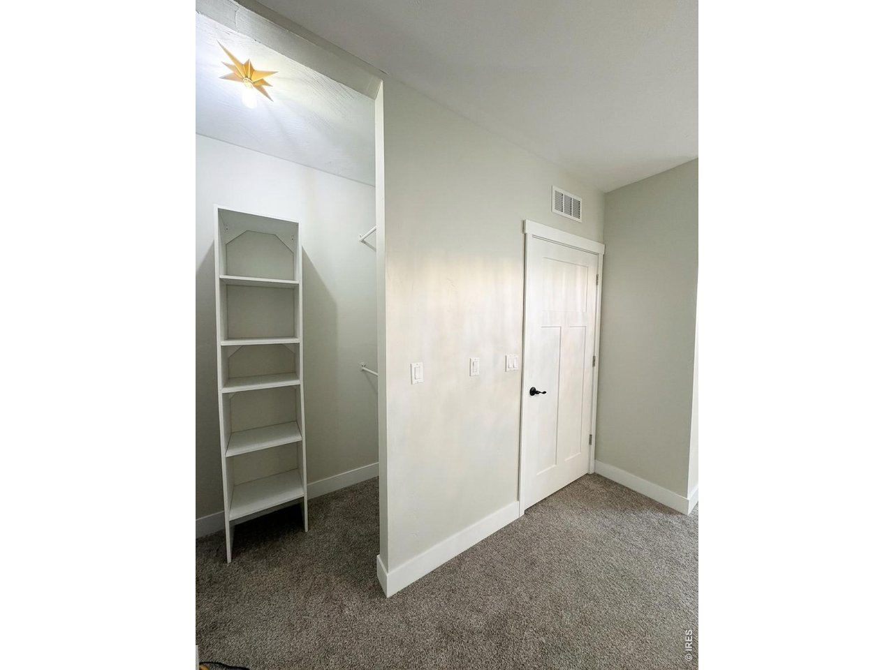 Property Photo 19 Basement bedroom 4, with closet organizers and storage under the stairs