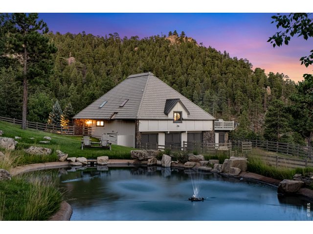 Property Photo 10 Building number 2 with guest studio and and a barn with 3 clean stalls (currently used for seasonal decor storage). Another pond with fountain can be found just outside