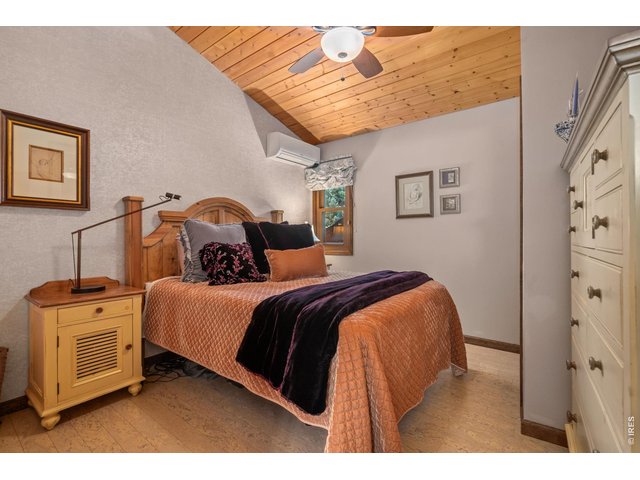 Property Photo 41 Guest bedroom w/ vaulted T&G ceilings
