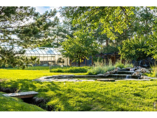 Property Photo 14 Duck pond w/ stream and foot bridge