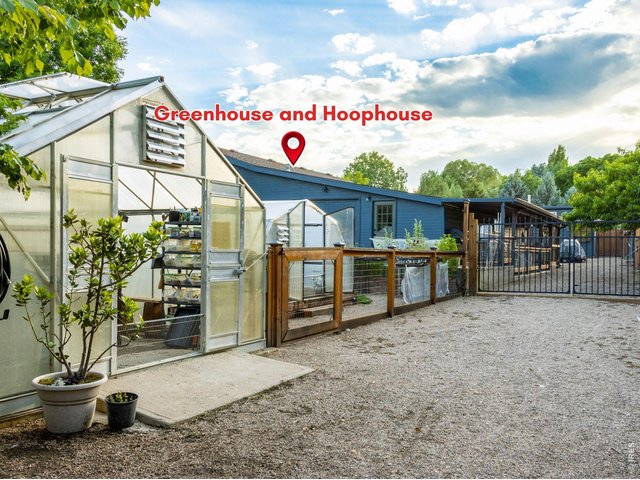 Property Photo 17 Heated greenhouse plus fans for cooling + (2) Hoop Houses