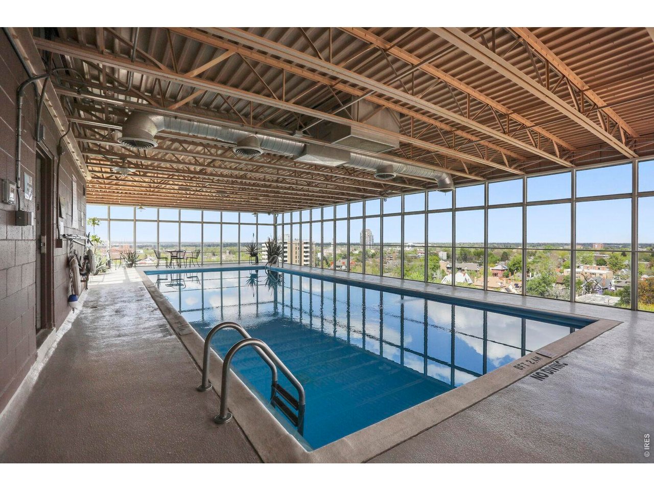 Roof top pool with floor to ceiling windows