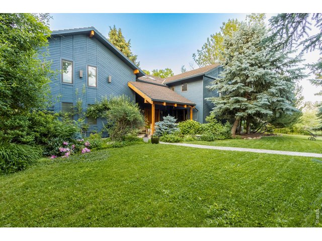 Property Photo 21 Beautiful front yard surrounded by mature trees