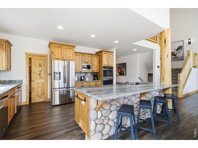 Property Photo 5 Open concept kitchen with oversized kitchen island perfect for entertaining