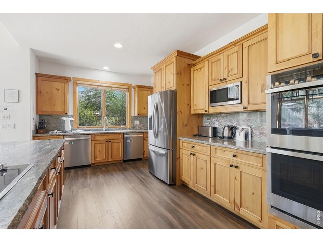 Property Photo 18 Beautifully updated kitchen with open flow to dining and great room