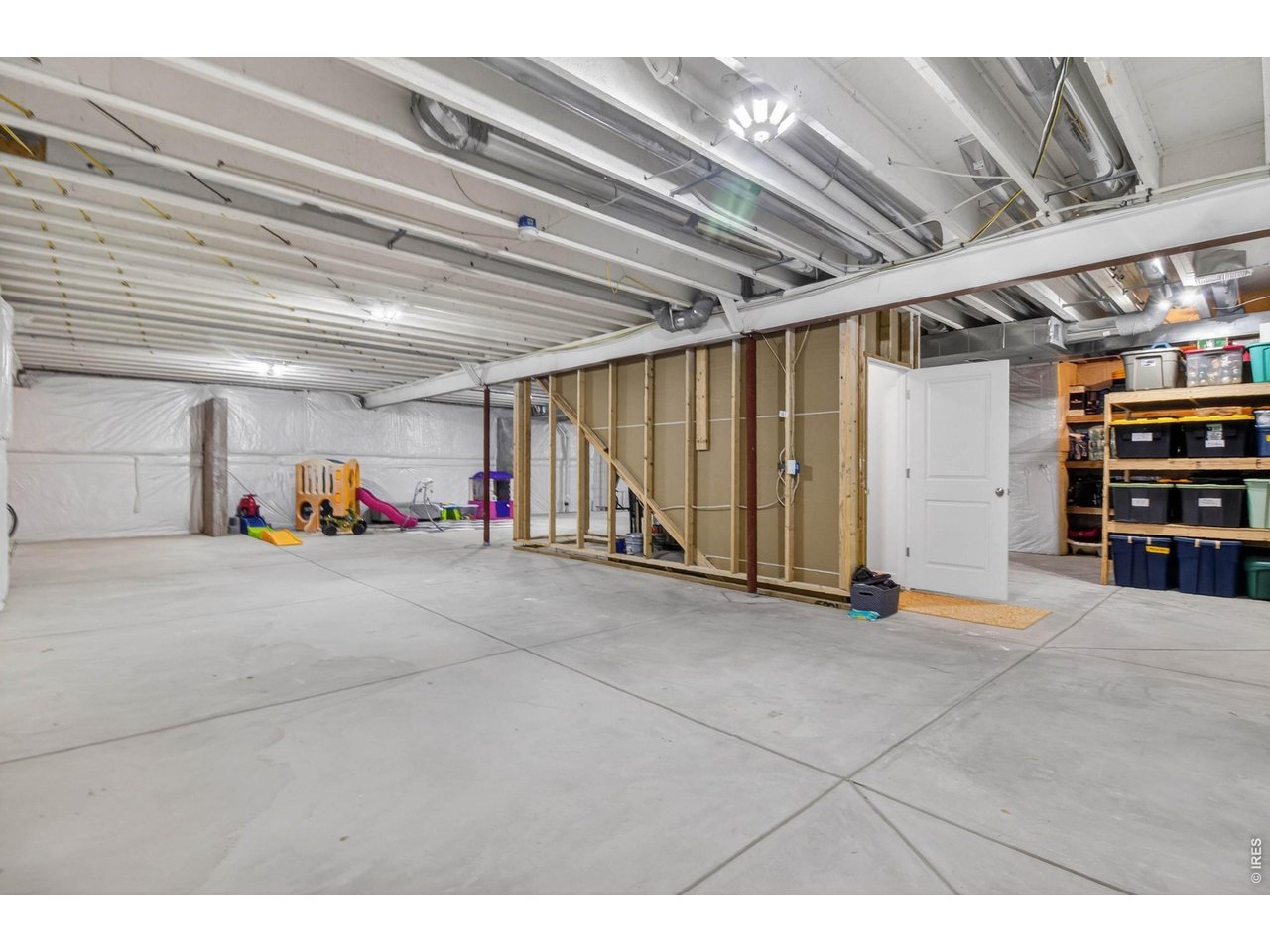 Unfinished basement is identical footprint to the main level, shelving units stay