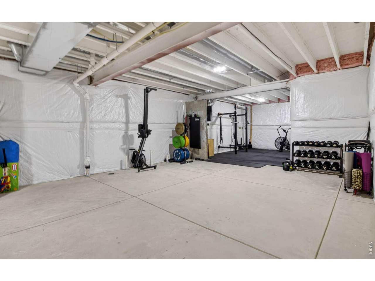 You have enough room for a gym and a golf simulator down here!