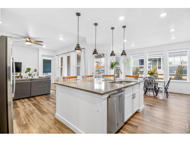 Property Photo 1 Large quartz kitchen island with double-basin sink and upgraded pendant lighting