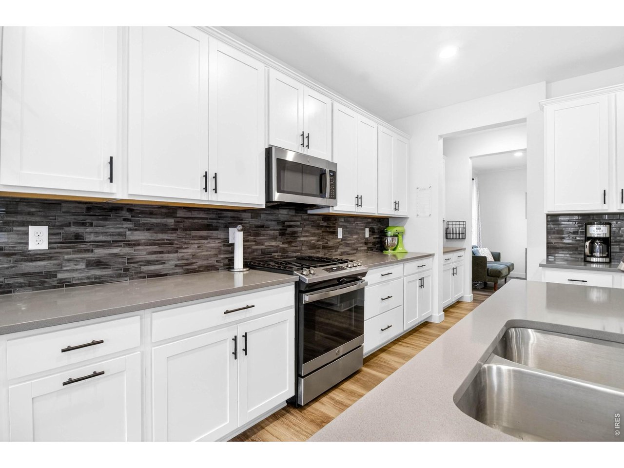 quartz countertops throughout kitchen into the butler's pantry