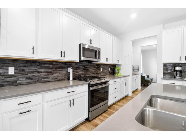 Property Photo 8 quartz countertops throughout kitchen into the butler's pantry