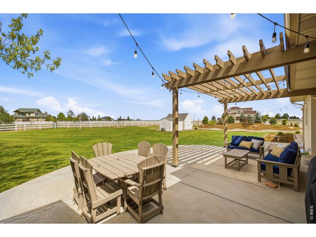Property Photo 39 Back patio with fully fenced yard, perfect for pets