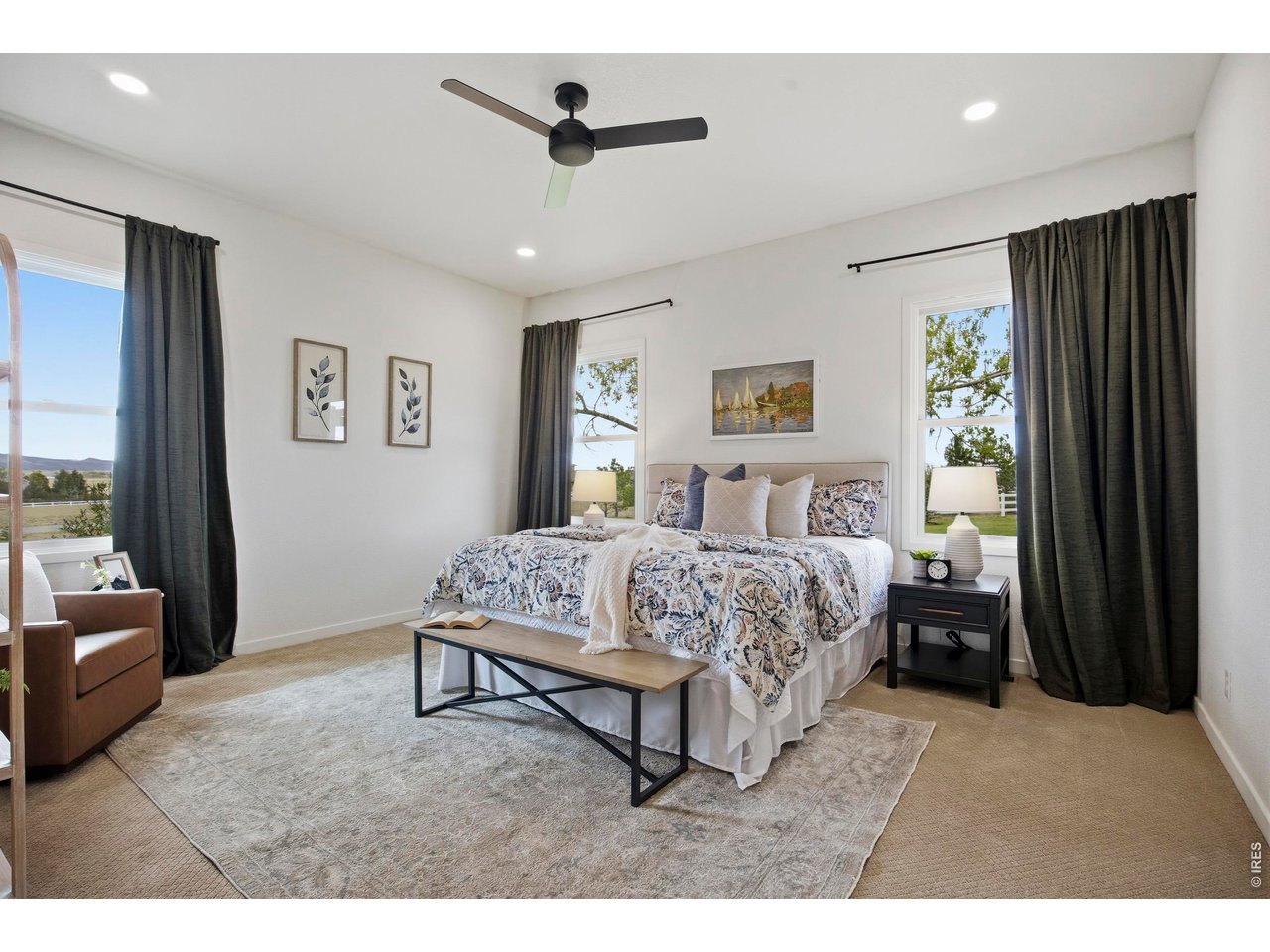Spacious primary suite, privately situated in the home