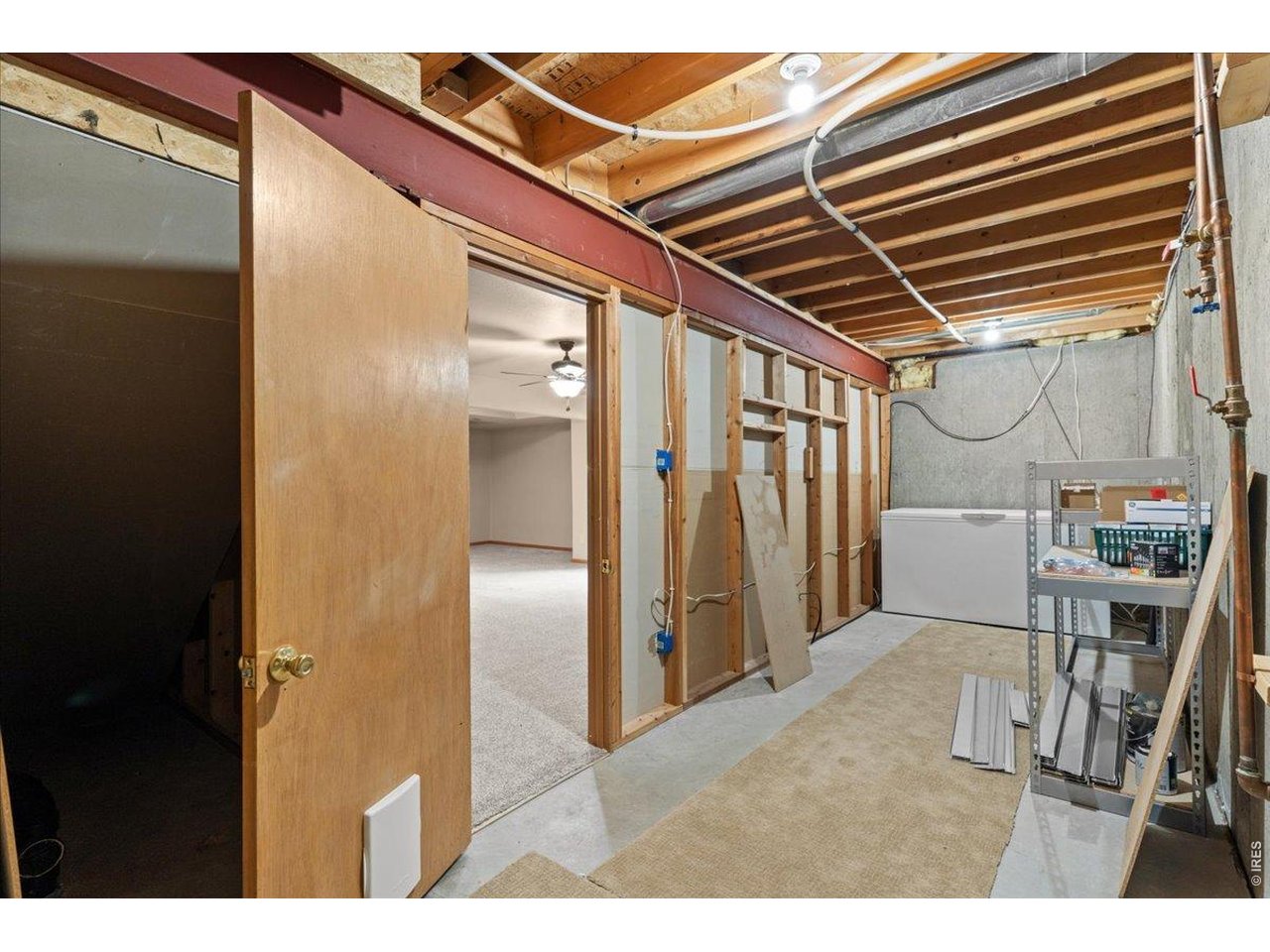 Huge storage space off basement living room. Deep freeze included