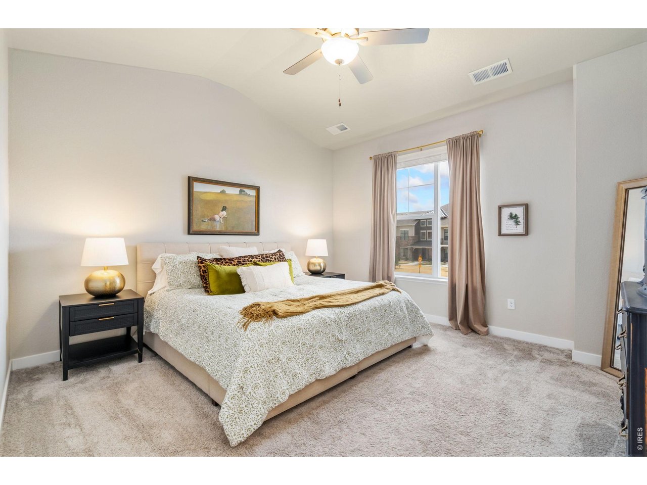 Primary bedroom with oversized windows and ensuite bath