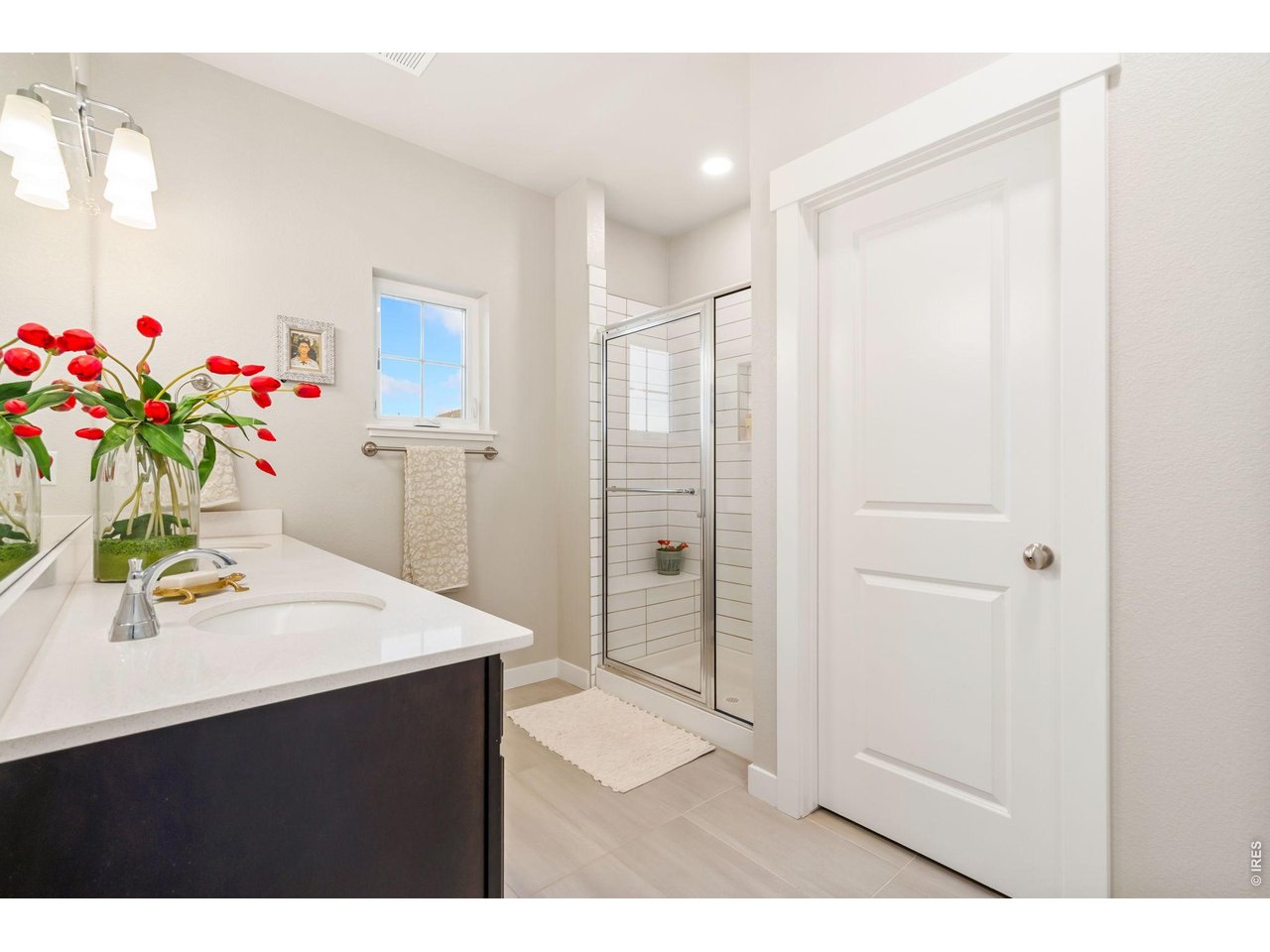 Primary suite with dual vanity and walk-in shower