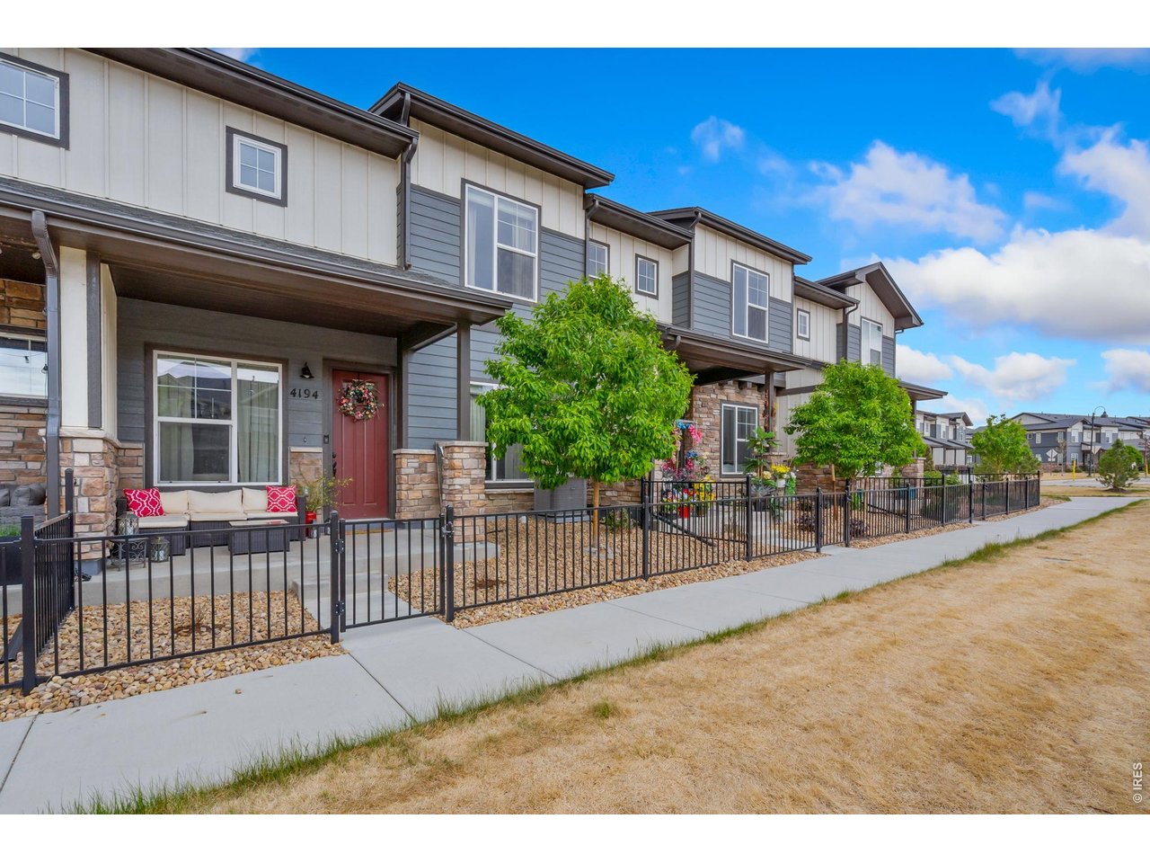 This home offers a covered front fenced patio and attached 2-car garage!