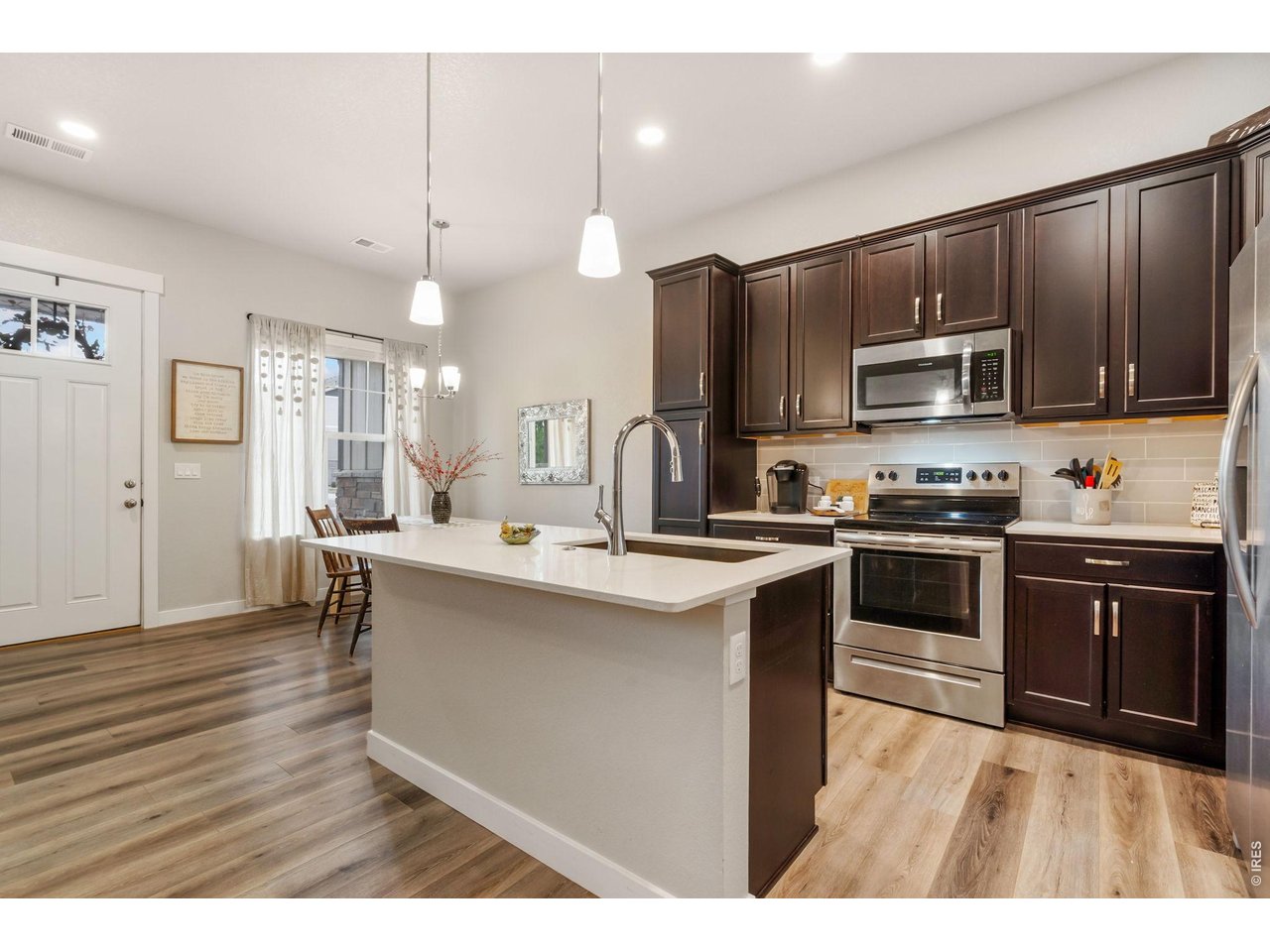Modern kitchen with quartz countertops and stainless steel appliances