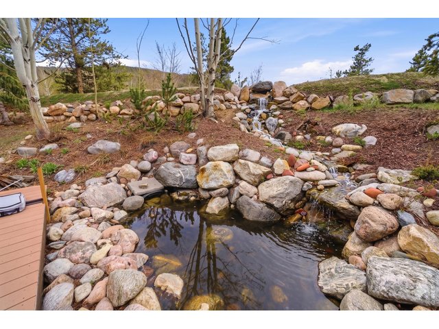 Property Photo 39 Enjoy the peaceful backyard waterfall and pond feature
