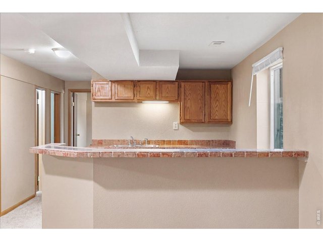 Property Photo 25 Tiled wet bar in basement