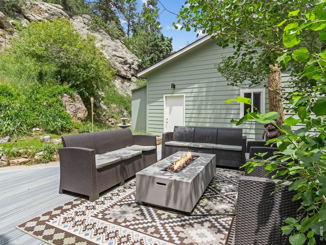 Property Photo 4 Private patio at main cottage with firepit