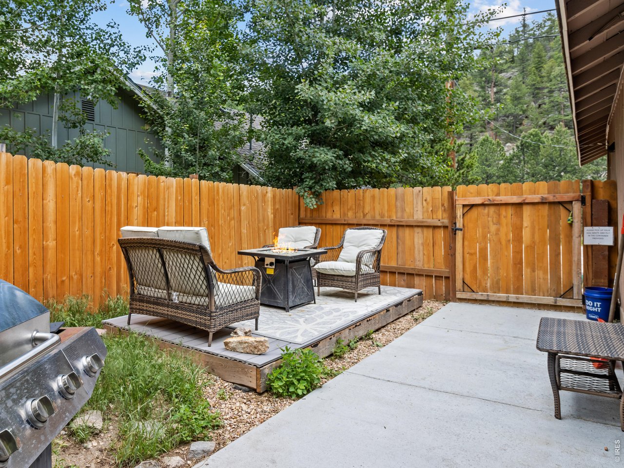 Side patio at guest cottage, with firepit