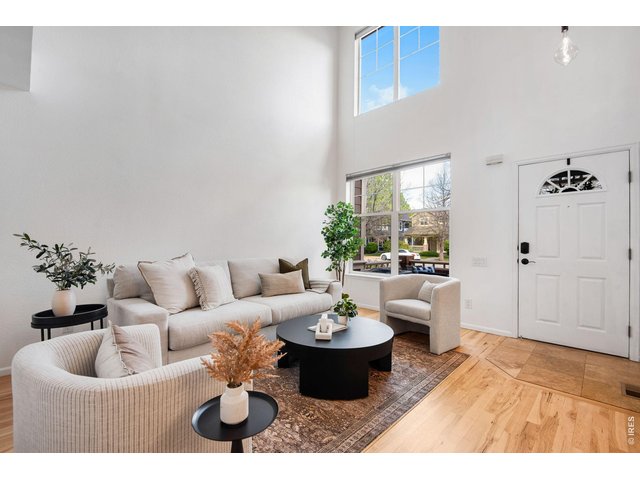 Property Photo 6 Airy & Bright! 2 Story windows, all newly refinished shiny Hickory flooring across the entire main level. 