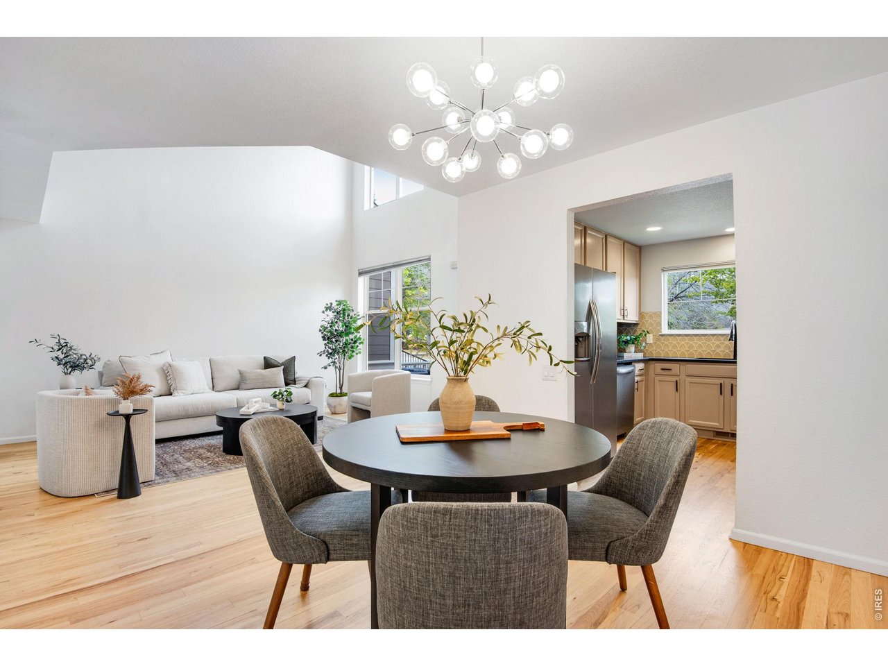 Pretty custom light fixtures, modern and fresh easy, open concept main level. 