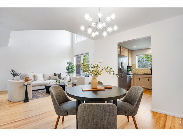 Property Photo 7 Pretty custom light fixtures, modern and fresh easy, open concept main level. 