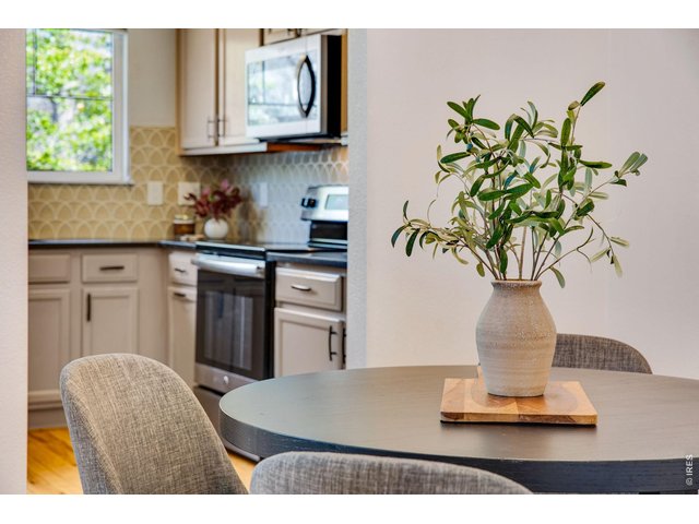 Property Photo 13 Stainless Steel appliances, great storage in the kitchen - easy access to dining! 