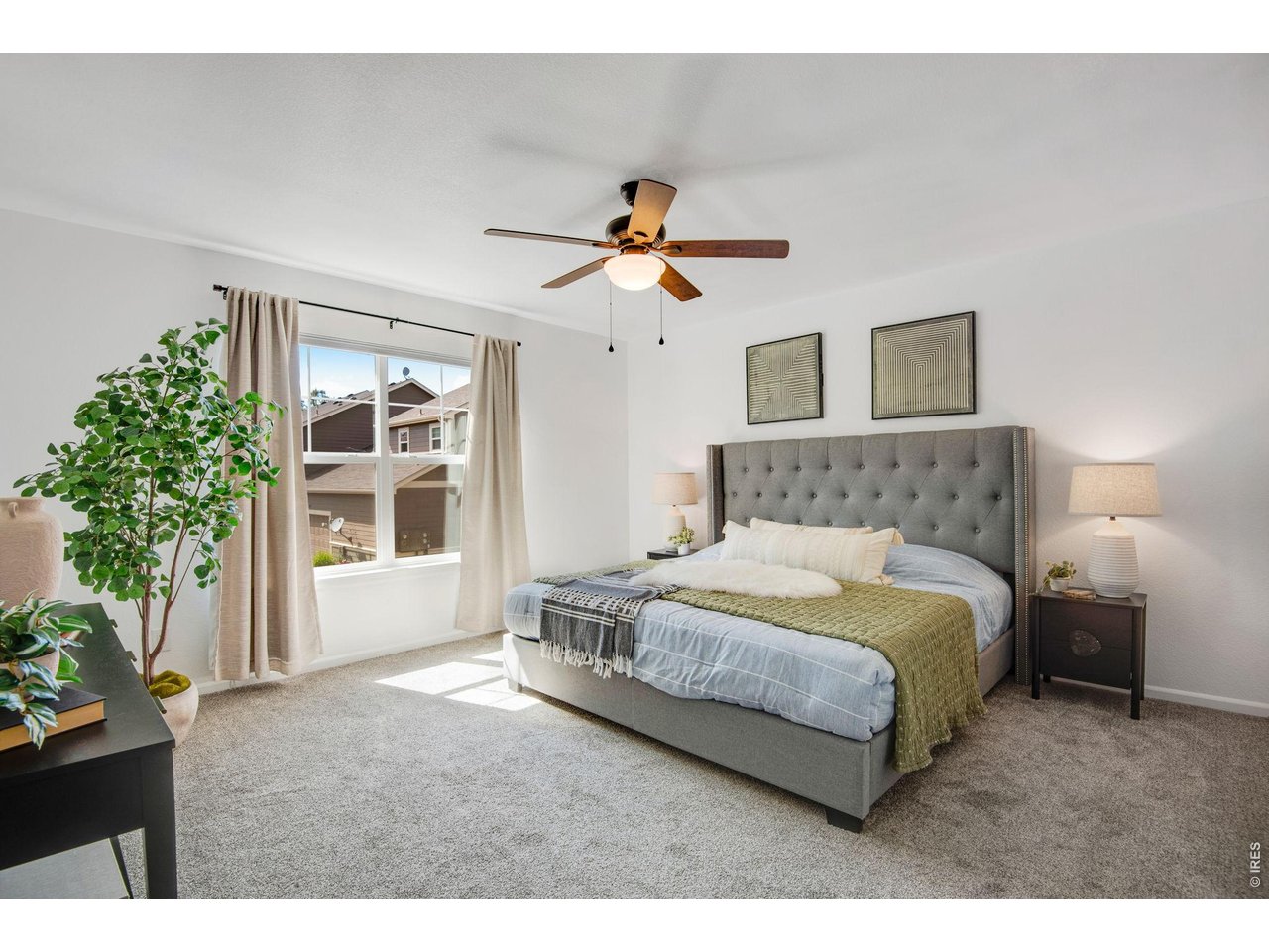 The Primary Suite! Newer Carpet, Spacious with ceiling fan, large sunny west facing picture window - beautiful views! 