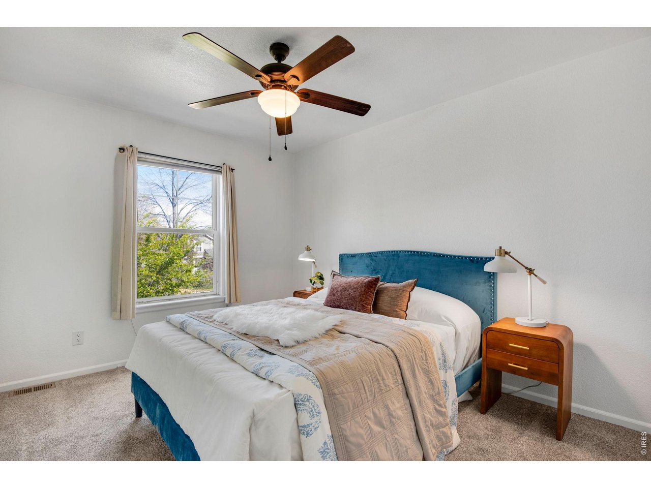 Cozy Secondary Bedroom, also new carpet and comfortable ceiling fan. 