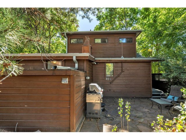 Property Photo 25 private back patio with covered bike and tool storage