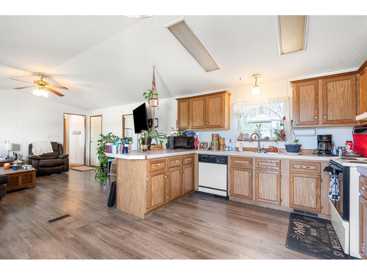 Open kitchen has LVP