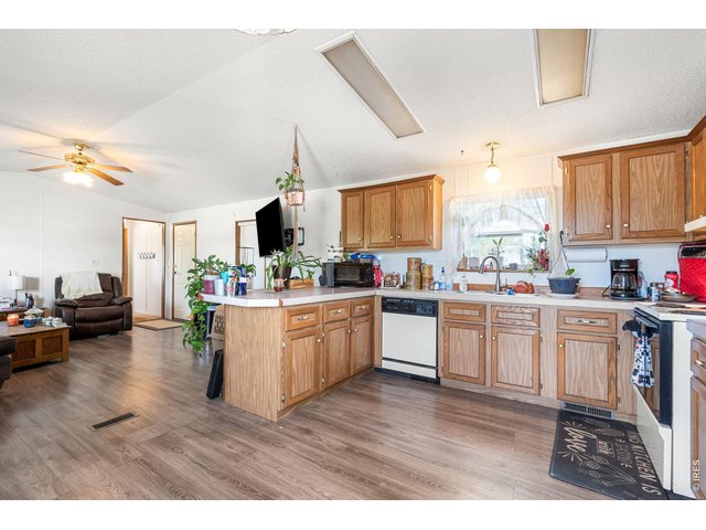 Property Photo 1 Open kitchen has LVP