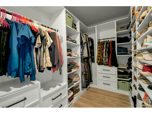 Property Photo 23 Large walk in closet with custom built-ins