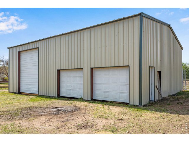 Property Photo 46 Shop is 48' x 41' it has a concrete floor but there is dirt on part of the perimeter. 
