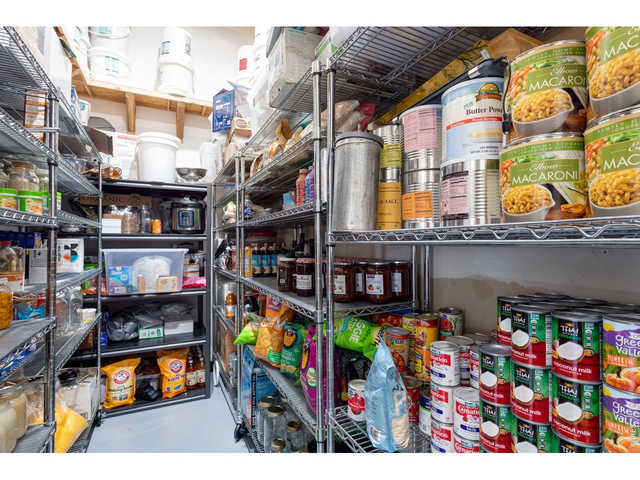 This large 14'x6' pantry is in the garage area off the mudroom next to the kitchen.