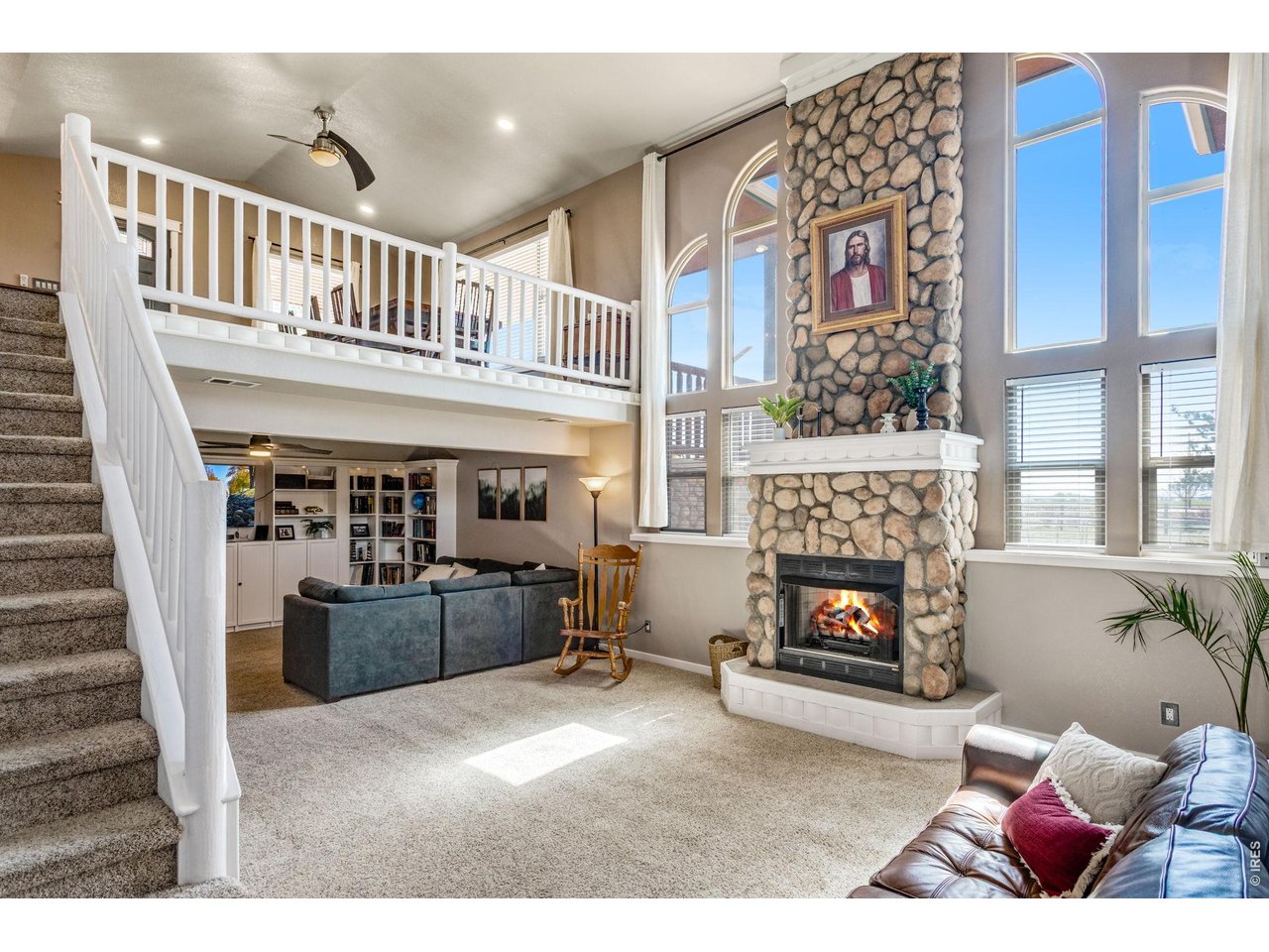 The lower level is no less impressive with the large west facing windows and stone gas fireplace.
