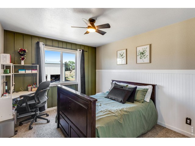 Property Photo 36 Upper-level Bedroom 4 is 12'x10' with north facing window. This bedroom has two closets!