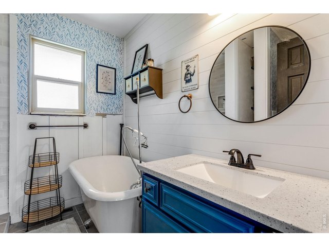 Property Photo 37 Upper-level full bathroom. There is also a shower you can partially see in the mirror.