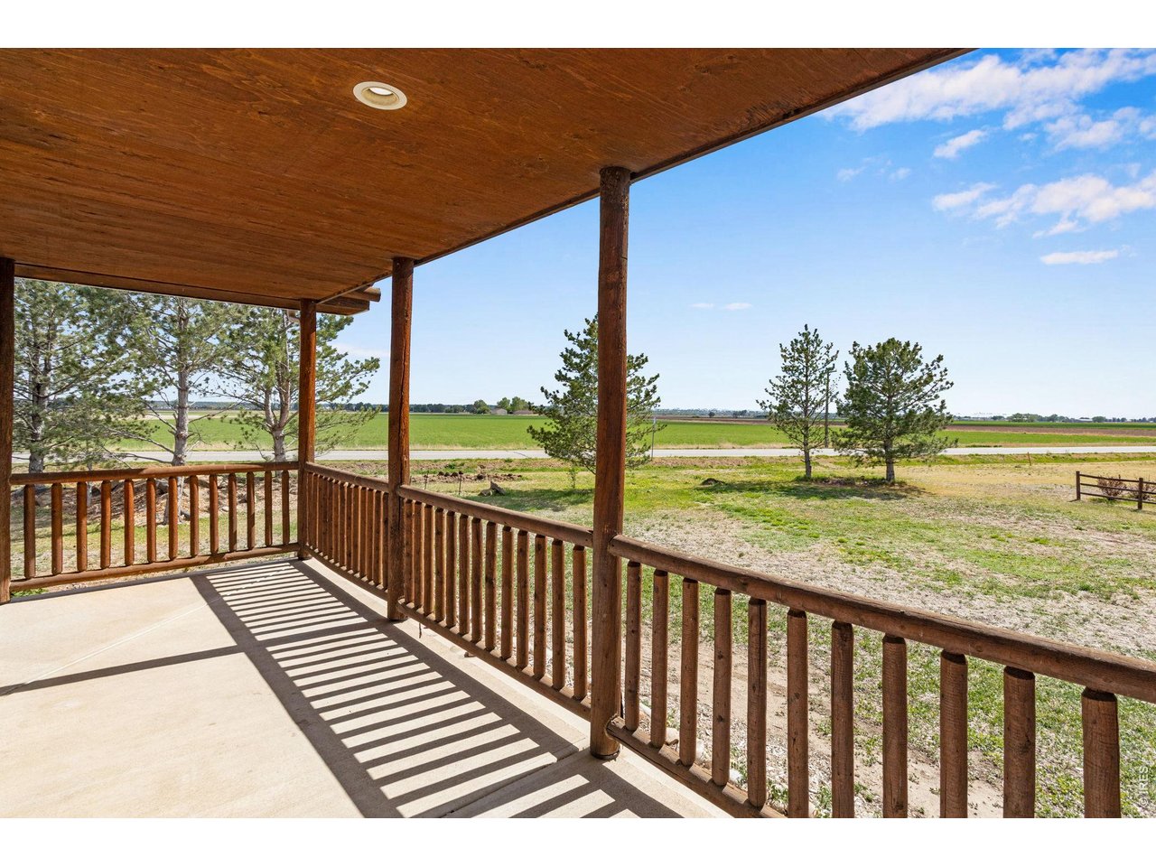 Enjoy views to the west and south from the wrap around covered patio