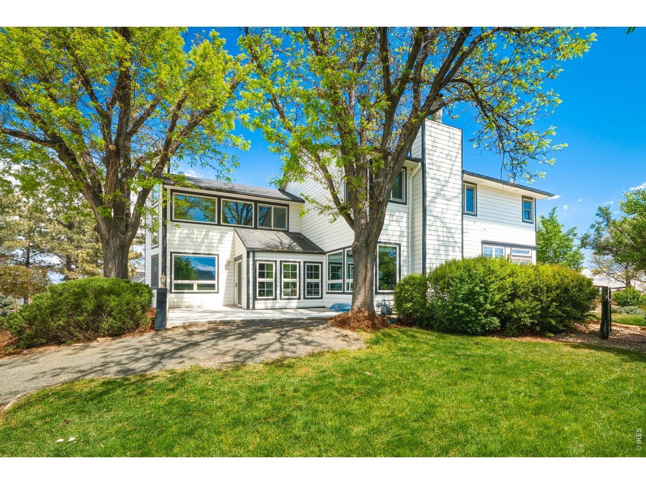 Backyard retreat with patio space, lush lawn & water feature. 