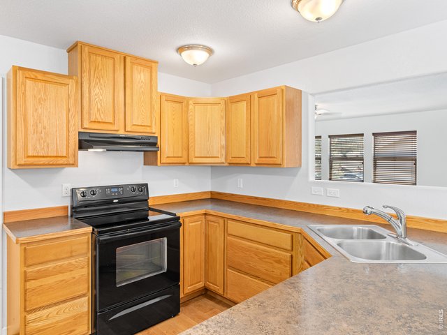 Property Photo 16 Kitchen opens to living room