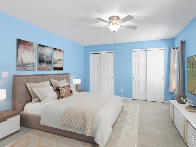 Property Photo 19 Primary suite, digitally staged